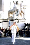 Il 1&#176; tedoforo Stefano Baldini con la Torcia olimpica in occasione della cerimonia ufficiale di inizio del Viaggio della Fiamma Olimpica in Italia.